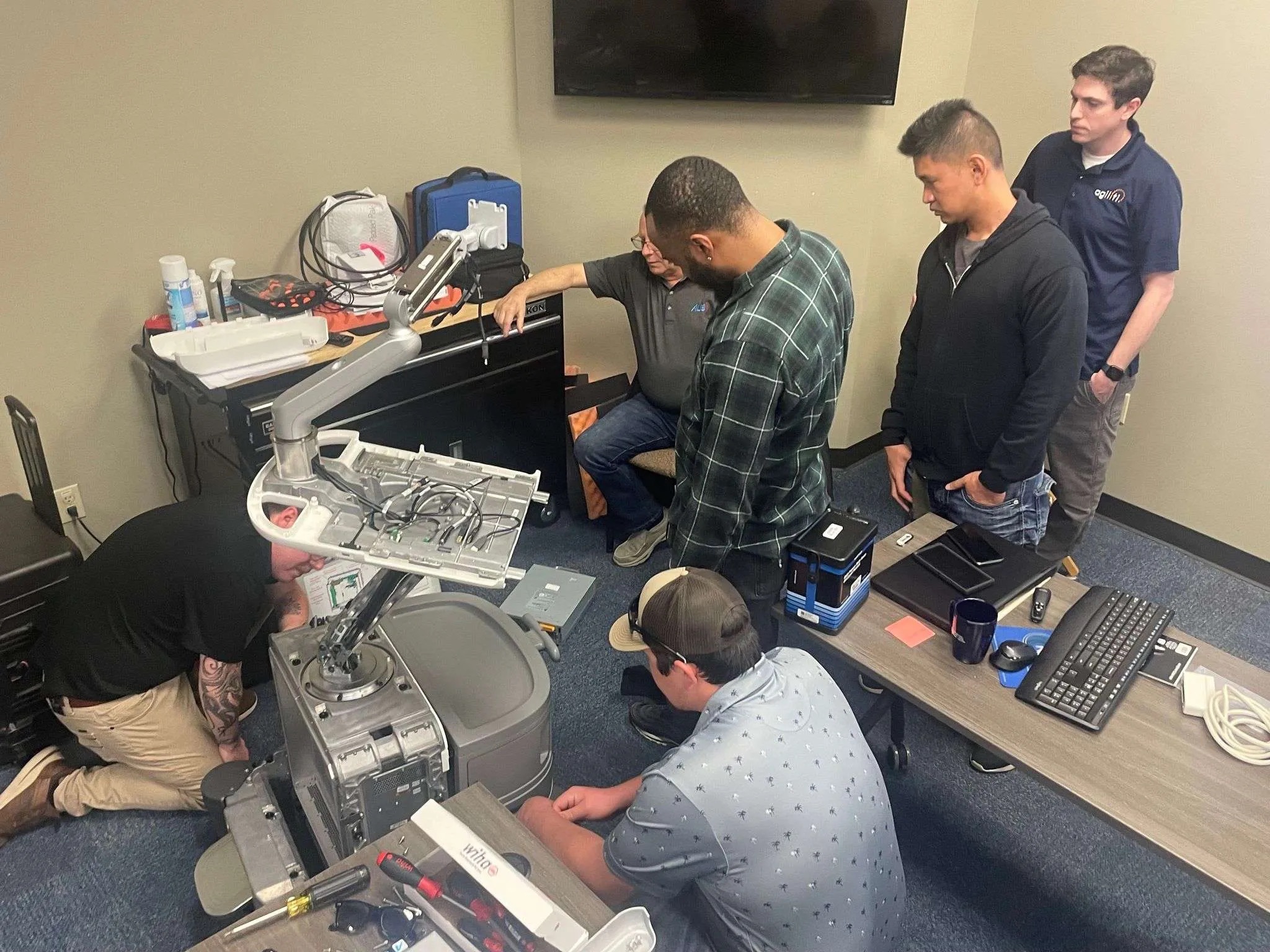 picture of a people repairing an ultrasound system